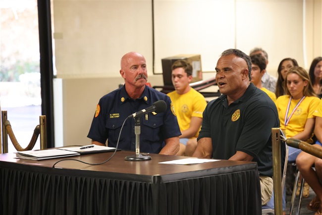 Kaua‘i Fire Department Chief Michael Gibson (left) and Ocean Safety Bureau Chief Kalani Vierra address the Fire Commission.