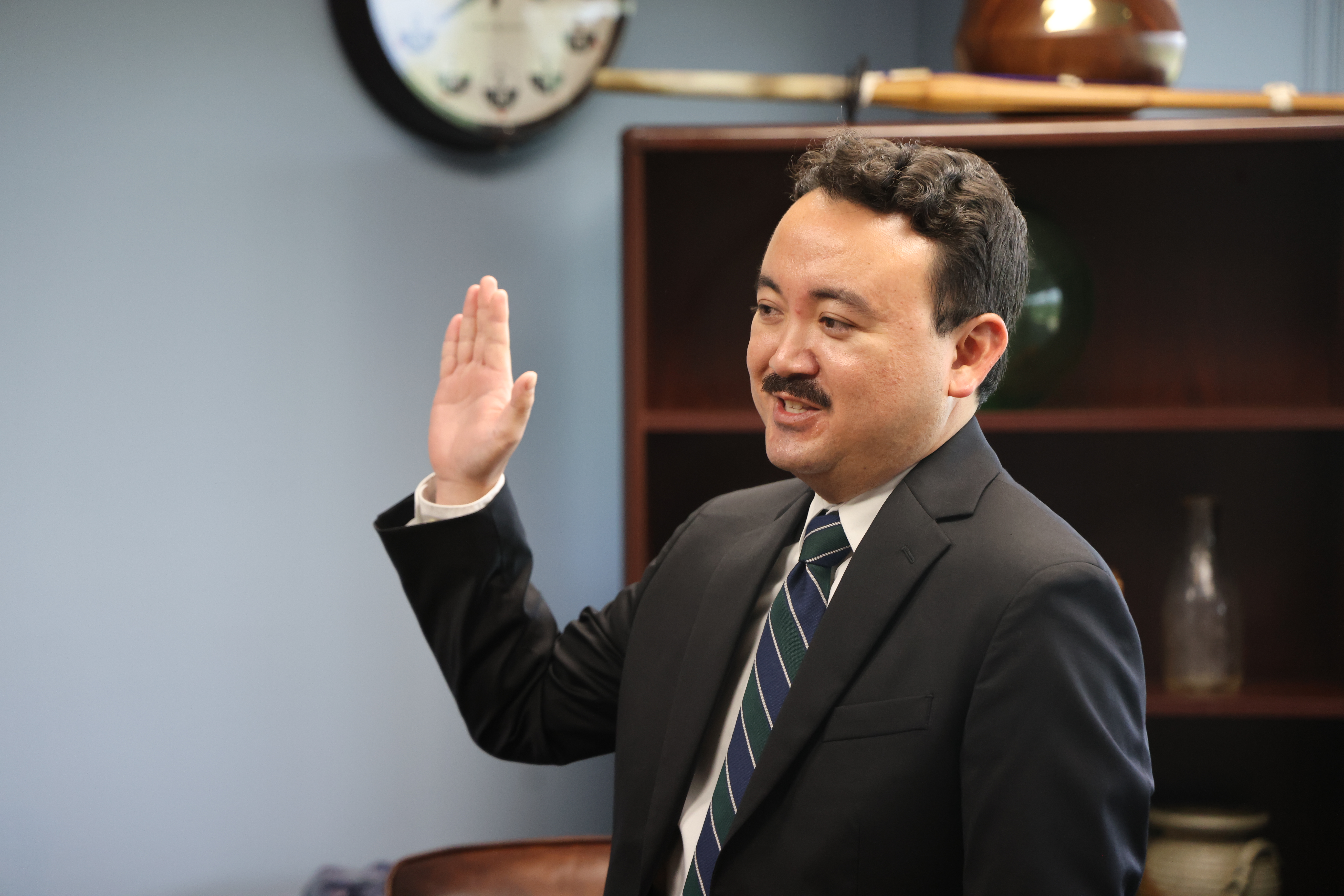 Tyler Saito sworn in as County Attorney.