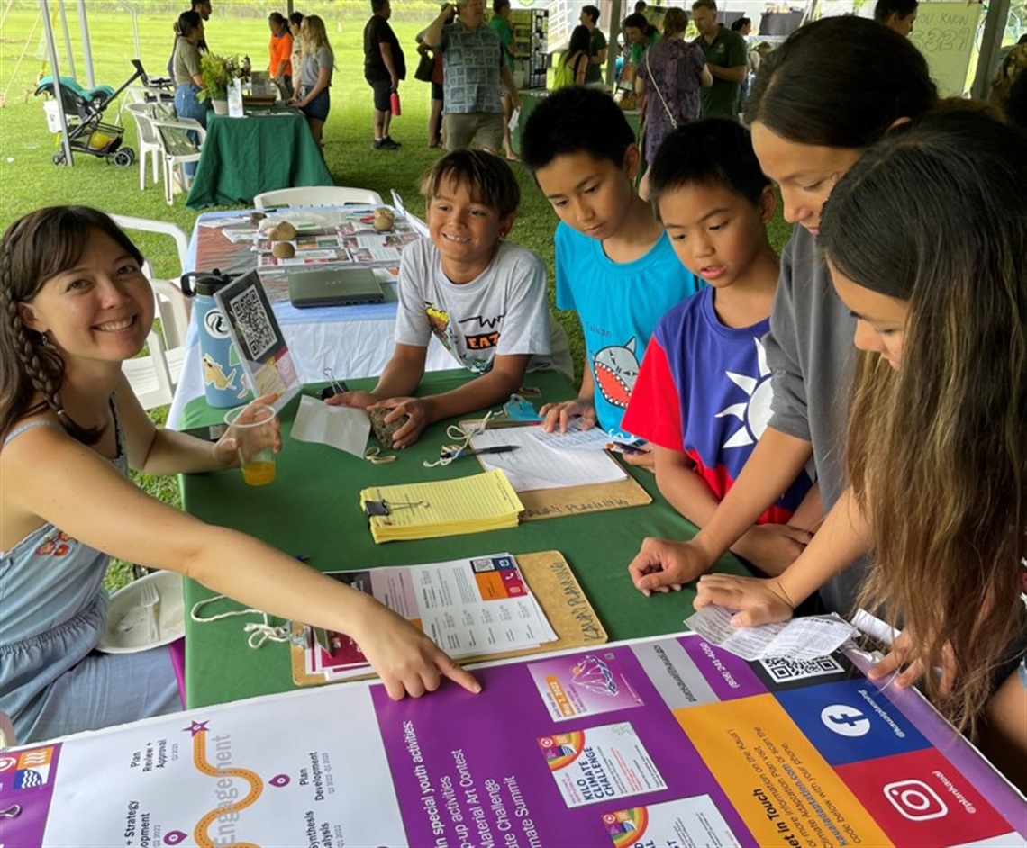 Plan outreach event at a community fair