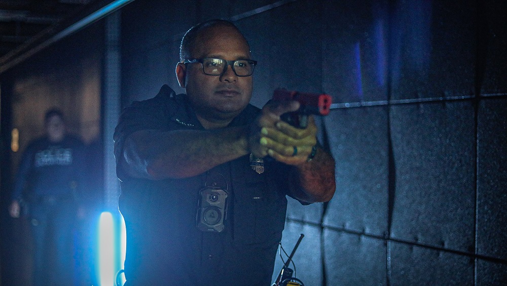 An officer hones critical skills while responding to an emergency simulation in the MILO Training Range.