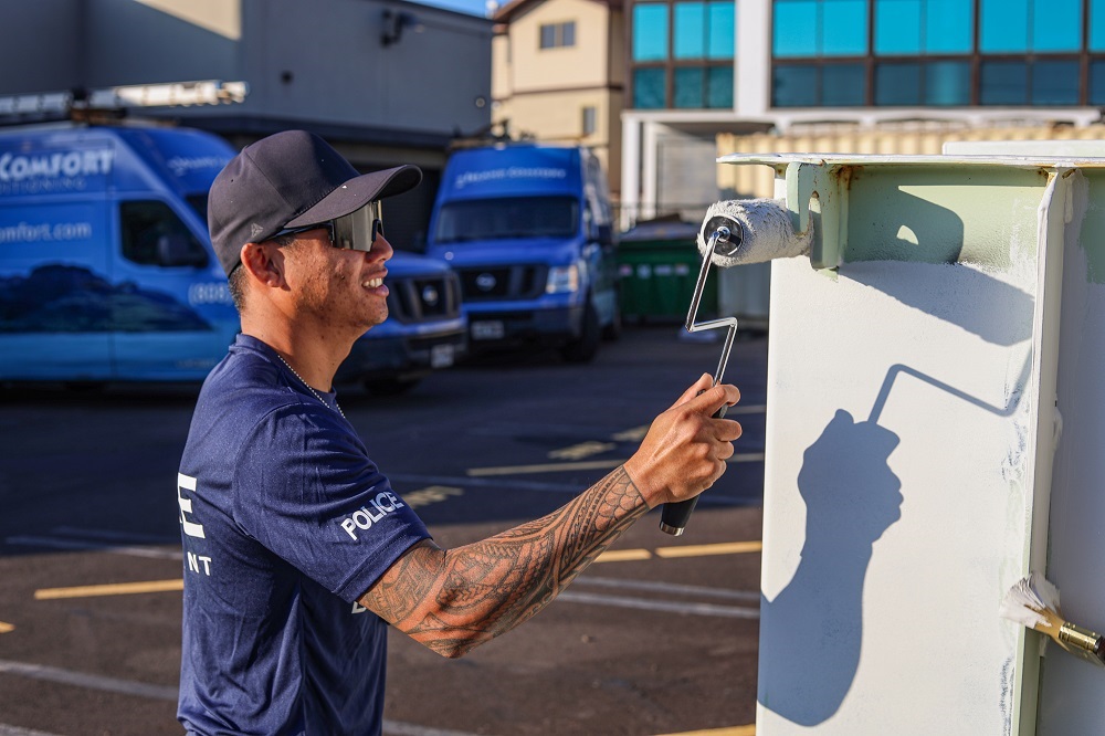 Officers cleaning graffiti