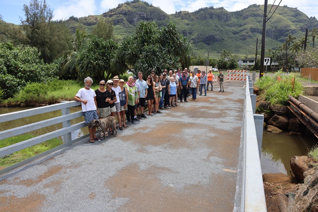 Group gathers for the reopening of the Niumalu Bridge.