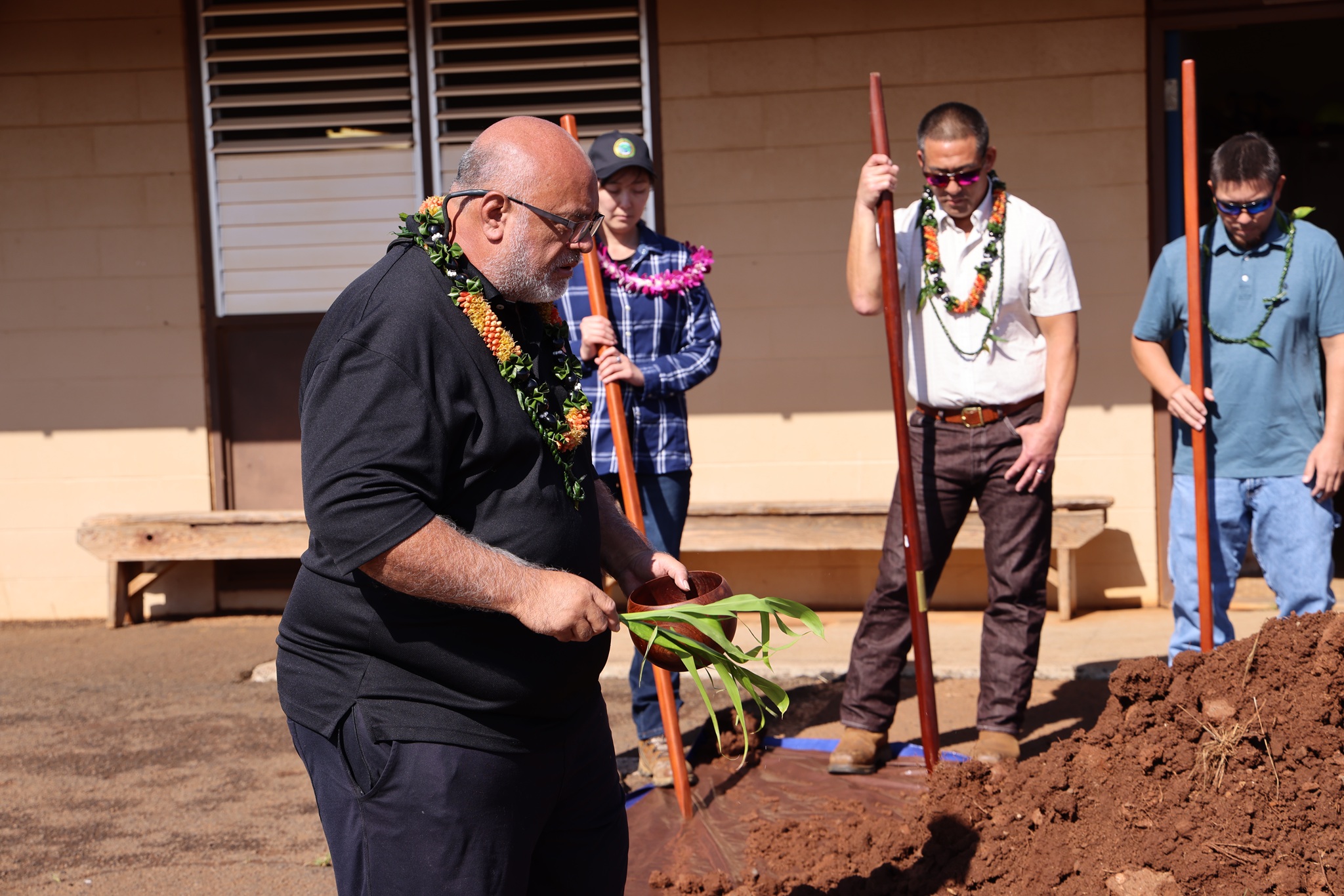 Kahu Sean Chun leads a blessing of the Hanapepe Baseyard Renovation project on March 25, 2026