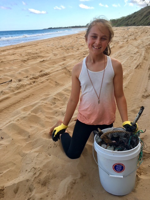 Volunteer cleaning beach
