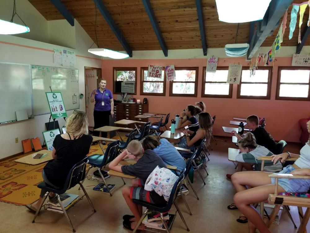 Tawna Bensaid, HI5 Recycling Specialist teaches a class of 7th graders