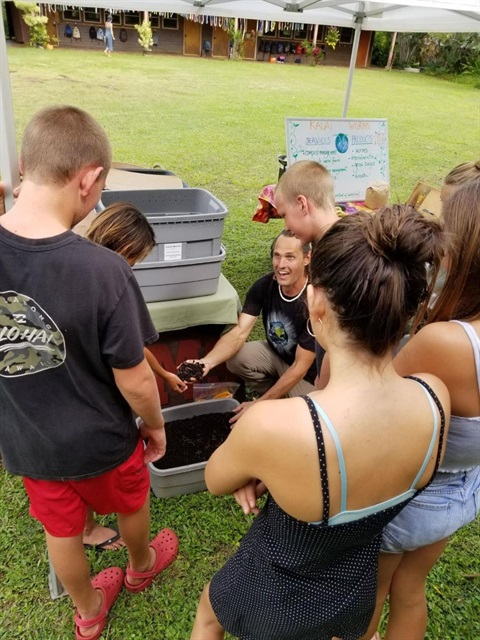 aro Spichal, owner of Kauai Worms, teaches a composting class to students