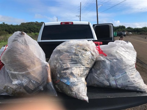 Trash picked up around Kapaa recycle bins.